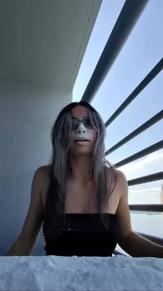 ElizabethEatsNYC wearing face paint in a public video preview.